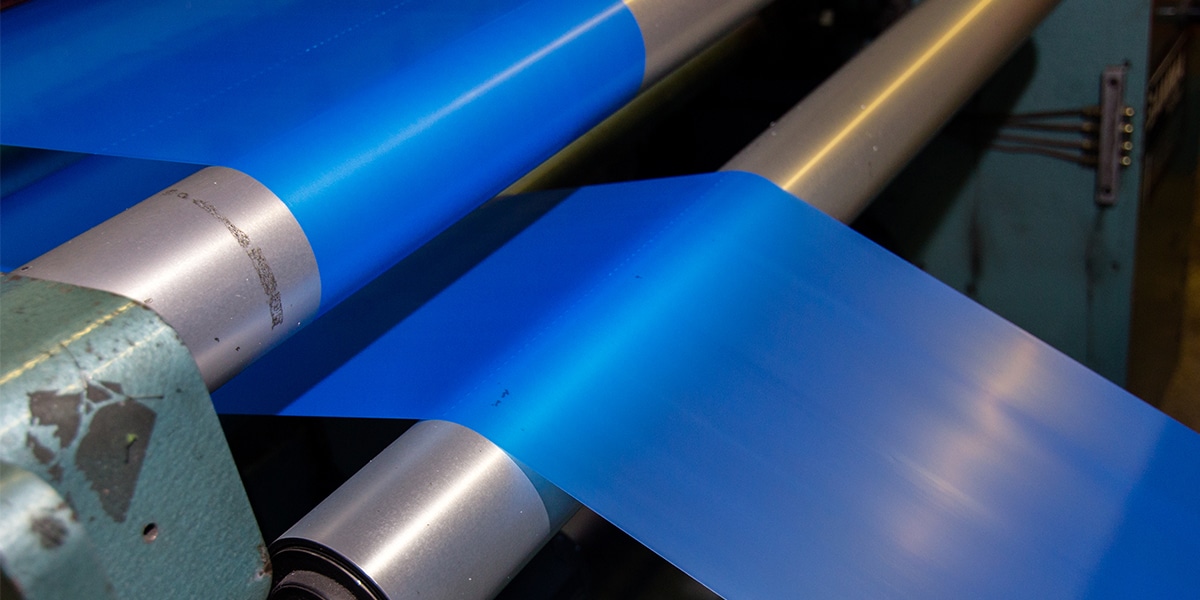 Blue plastic packaging on production machine